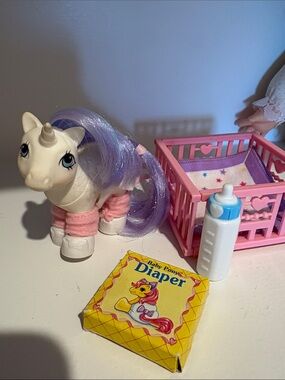 My Little Pony White Unicorn with Purple Mane and Pink Accessories. Baby. Crib.